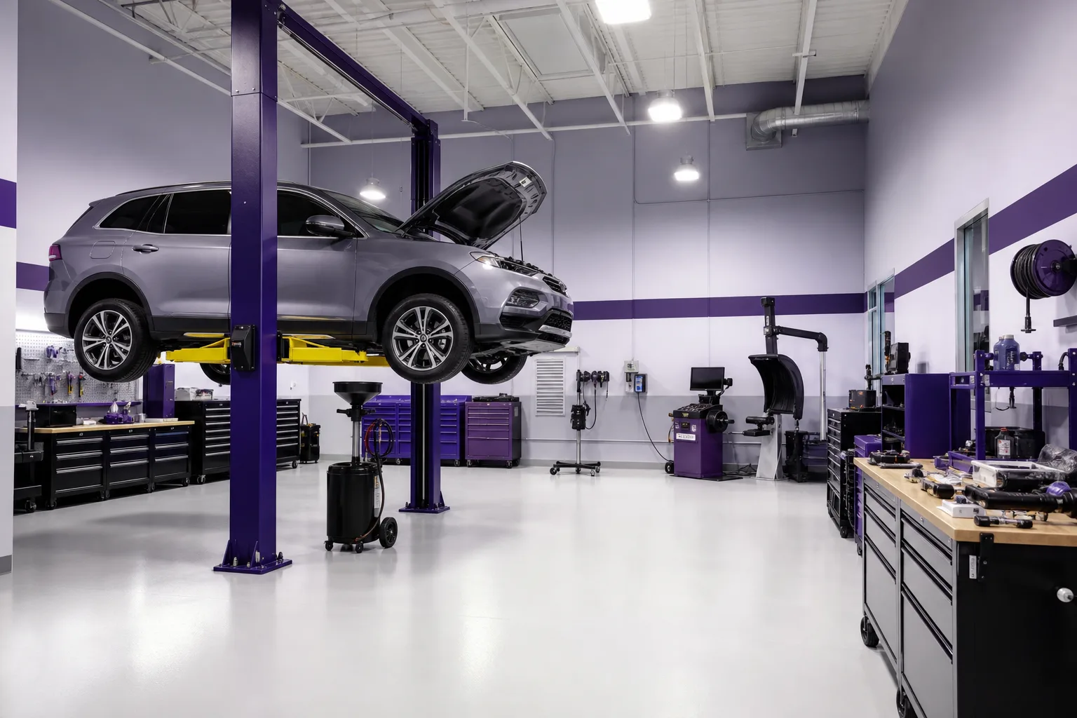 Interior of xenoglossyx service bay with lift, diagnostic equipment and organized tool stations, 1200x800